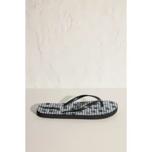 Ysabel Mora Black Flower teenslippers in zwart en wit